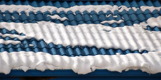 blue tile roof with bands of snow