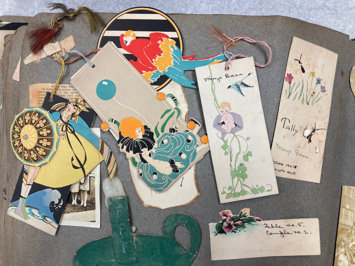 a scrapbook page featuring various bridge cards and place cards